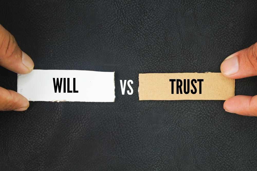 Paper with the words trust vs will. living trust might be more than you need for your situation