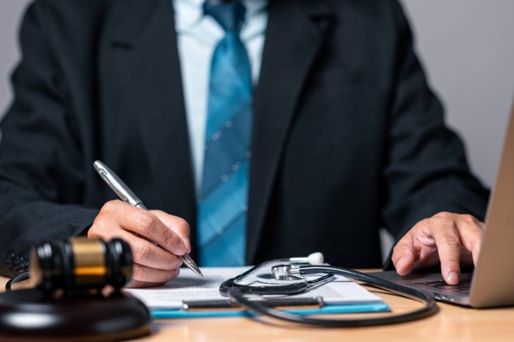 Personal injury law concept. The expertise of a lawyer becomes paramount when seeking fair legal resolutions in medically intricate scenarios.