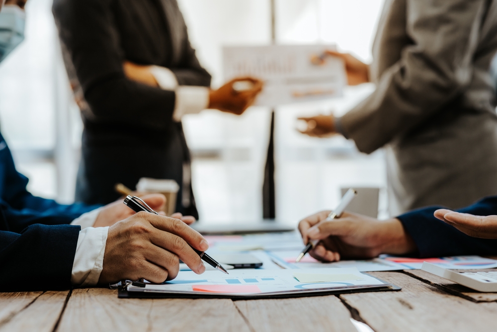 Team of business people meeting for business planning, brainstorming, accounting, tax and brokerage.